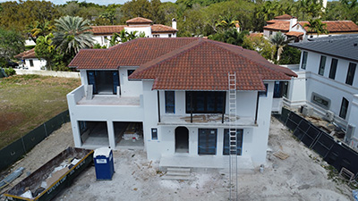 Finished asphalt shingle roof under DOGA Construction legal terms