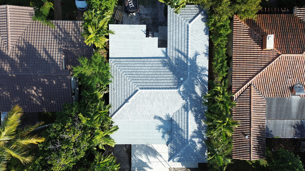 installation of gray tile roof -High-resolution image showing the sky above a home in Miami FL 33145, perfect for gray tile roofing.