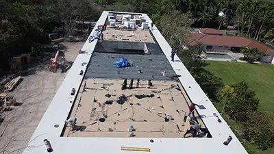 Flat commercial roof installation in Miami FL 33143 under construction