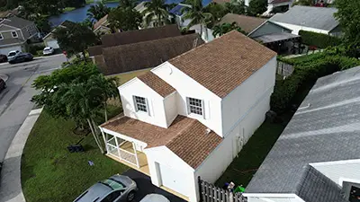 Completed orange shingle roof in Sunrise FL