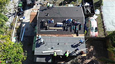 Completed asphalt roof in brick tone