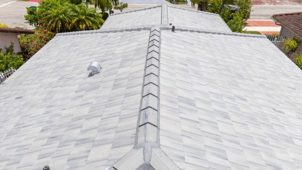 New gray shingle roof installed by Doga Construction in a residential area.